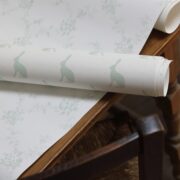 Mini Hares Soft Green on Natural Wallpaper - Image 2