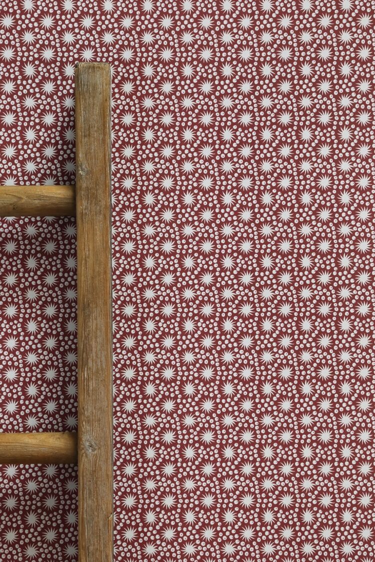 Tiny Sundance Maroon Background Wallpaper